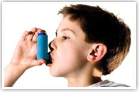 A young boy uses an inhaler. Image taken from the Take Action On Asthma leaflet. A young boy uses an inhaler. Image taken from the Take Action On Asthma leaflet.