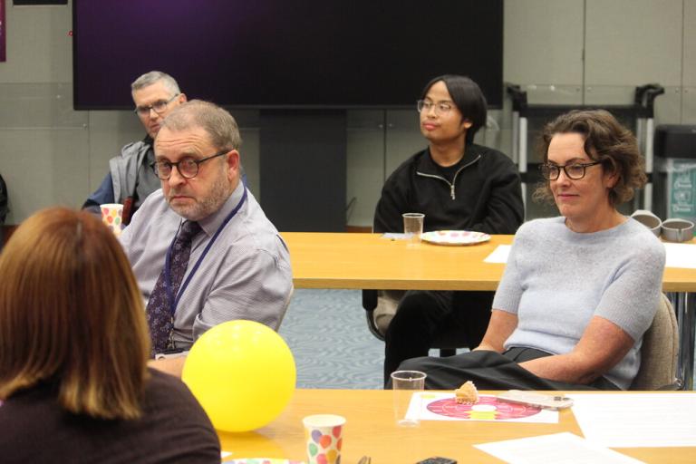 Residents and staff sit together at a charter for public participation session