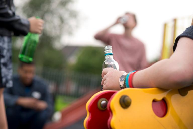 People drinking in a park