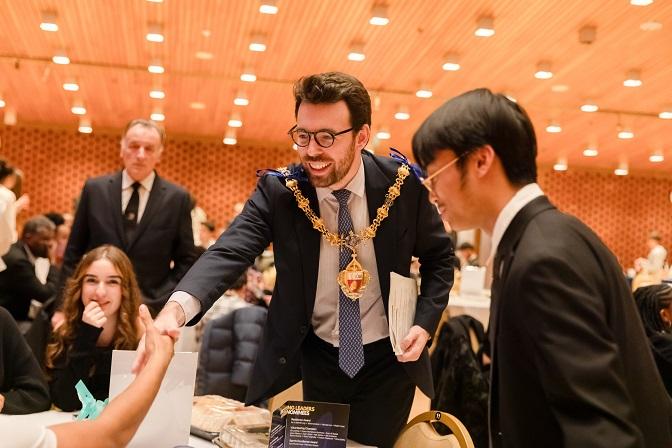 The mayor of Kensington and Chelsea congratulates a winner of a 2024 Young Leaders Award