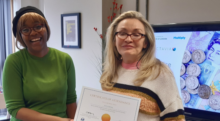 Resident receiving a Money Wise course certificate