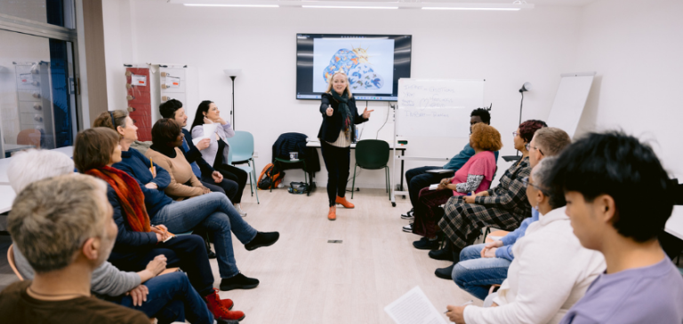 Residents taking part in a group activity at an adult learning class at Kensington and Chelsea Libraries